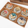 Personalized Epoxy Resin Magnet Wedding Favors, Wedding Favors for Guests in Bulk, Bridal Shower Favors, Shower Favors, Graduation Items designed by Happy Times Favors, a handmade gift shop. Epoxy Resin magnet favor decorated with real natural dried flowers and Custom wooden tag. Ideal for wedding favors, unique gifts for guests, thank you gifts, Baby shower, baptism, Communion, bridal shower, baptism, bridesmaid, engagement, party gifts.