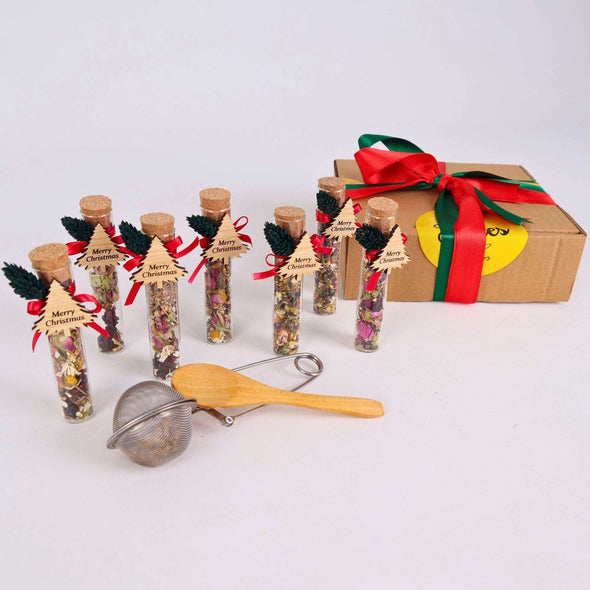 Christmas Gift Box 10 Pcs, Xmas Party Tea Favors, Christmas Loose Leaf Tea Sampler Gift Set, Gift Box Men, Gift for Sister Items designed by Happy Times Favors, a handmade gift shop. These glass cork vials/jars are filled with 11 different tea. Ideal for Christmas, Noel, New Year, Happy Holiday party gifts, Personalized Christmas Gifts, Custom Gifts for Christmas, Christmas gifts for family, friends, coworkers, Xmas favors, Noel gifts
