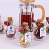 Christmas Tea favors for guests, Personalized Bulk Christmas gifts, Happy Holiday favors, Loose Leaf Tea Favor, Tea jars, Unique gift, Herbal Tea gifts Items designed by Happy Times Favors, a handmade gift shop. These glass cork vials/jars are filled with 11 different tea. Ideal for Christmas, Noel, New Year, Happy Holiday party gifts. Personalized Christmas Gifts, Custom Gifts for Christmas.