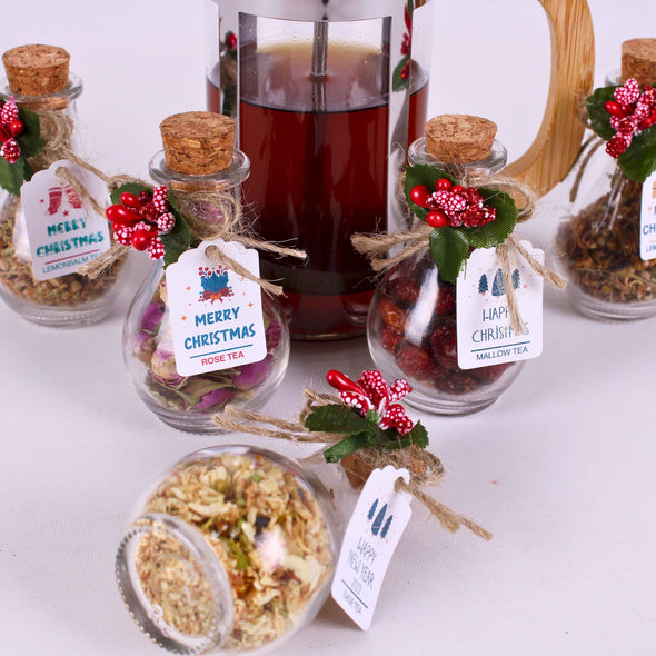 Christmas Tea favors for guests, Personalized Bulk Christmas gifts, Happy Holiday favors, Loose Leaf Tea Favor, Tea jars, Unique gift, Herbal Tea gifts Items designed by Happy Times Favors, a handmade gift shop. These glass cork vials/jars are filled with 11 different tea. Ideal for Christmas, Noel, New Year, Happy Holiday party gifts. Personalized Christmas Gifts, Custom Gifts for Christmas.