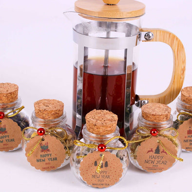 Christmas Tea favors for guests, Personalized Bulk Christmas gifts, Happy Holiday favors, Loose Leaf Tea Favor, Tea jars, Unique gift, Herbal Tea gifts Items designed by Happy Times Favors, a handmade gift shop. These glass cork vials/jars are filled with 11 different tea. Ideal for Christmas, Noel, New Year, Happy Holiday party gifts. Personalized Christmas Gifts, Custom Gifts for Christmas.