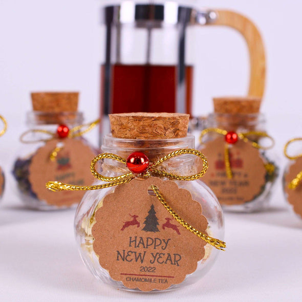 Christmas Tea favors for guests, Personalized Bulk Christmas gifts, Happy Holiday favors, Loose Leaf Tea Favor, Tea jars, Unique gift, Herbal Tea gifts Items designed by Happy Times Favors, a handmade gift shop. These glass cork vials/jars are filled with 11 different tea. Ideal for Christmas, Noel, New Year, Happy Holiday party gifts. Personalized Christmas Gifts, Custom Gifts for Christmas.
