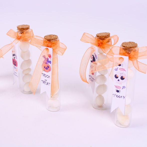 Halloween Candy Favors-Halloween Party Gifts Items designed by Happy Times Favors, a handmade gift shop. Tube with candies, with a nice sateen-tulle ribbon bow tie and white tag. Ideal for Halloween, Christmas, wedding favors, unique gifts for guests, thank you gifts, bridal shower favors, baptism favors, bridesmaid favors, engagement favors, party gifts.