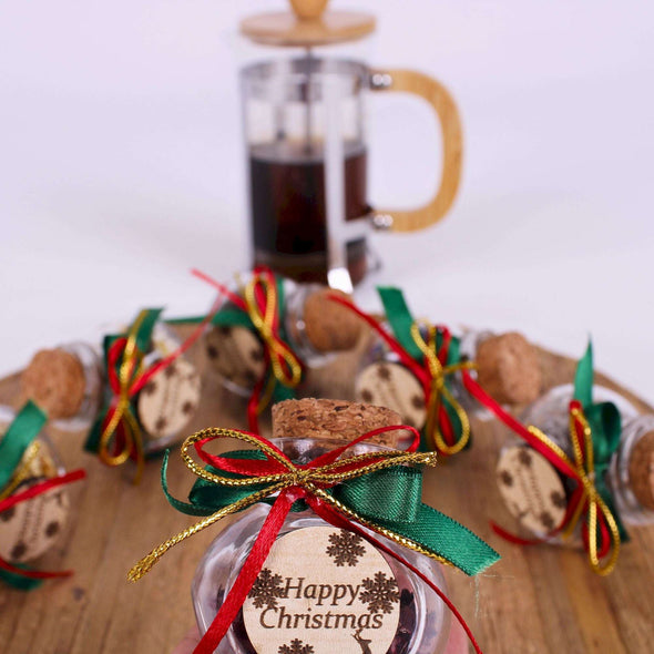 Christmas Tea favors for guests, Personalized Bulk Christmas gifts, Happy Holiday favors, Loose Leaf Tea Favor, Tea jars, Unique gift, Herbal Tea gifts Items designed by Happy Times Favors, a handmade gift shop. These glass cork vials/jars are filled with 11 different tea. Ideal for Christmas, Noel, New Year, Happy Holiday party gifts. Personalized Christmas Gifts, Custom Gifts for Christmas.