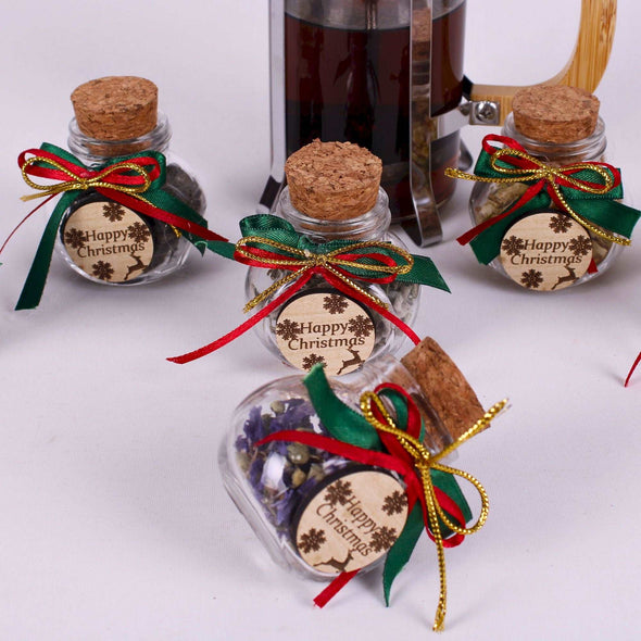 Christmas Tea favors for guests, Personalized Bulk Christmas gifts, Happy Holiday favors, Loose Leaf Tea Favor, Tea jars, Unique gift, Herbal Tea gifts Items designed by Happy Times Favors, a handmade gift shop. These glass cork vials/jars are filled with 11 different tea. Ideal for Christmas, Noel, New Year, Happy Holiday party gifts. Personalized Christmas Gifts, Custom Gifts for Christmas.